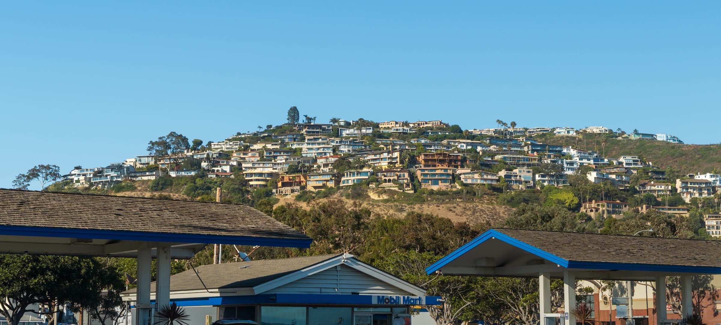 Houses on a hilltop in Laguna Beach seen from across the street