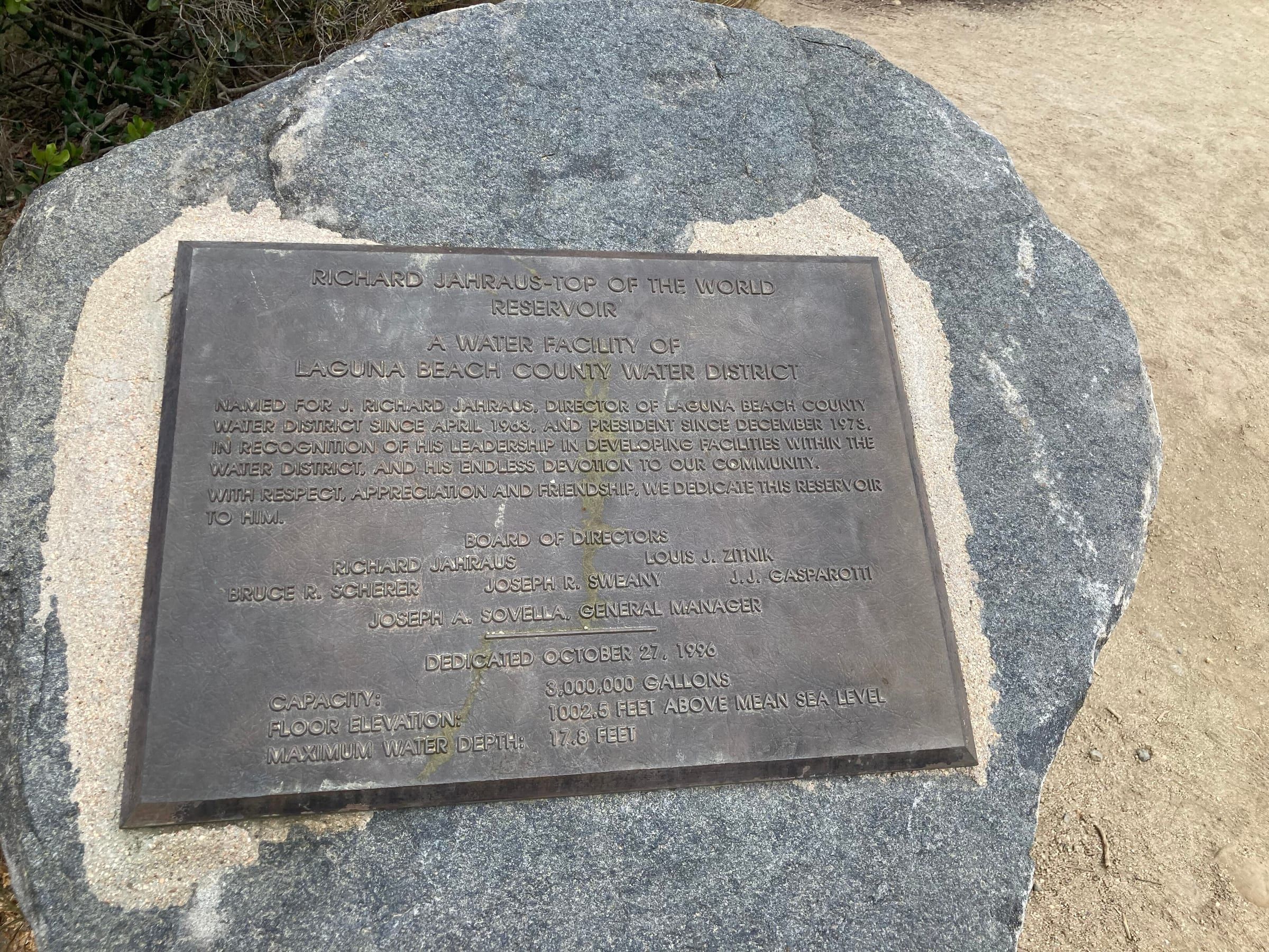 Bronze plaque set in a boulder naming the Top of the World Reservoir in Laguna Beach, a water facility of the Laguna Beach County Water District